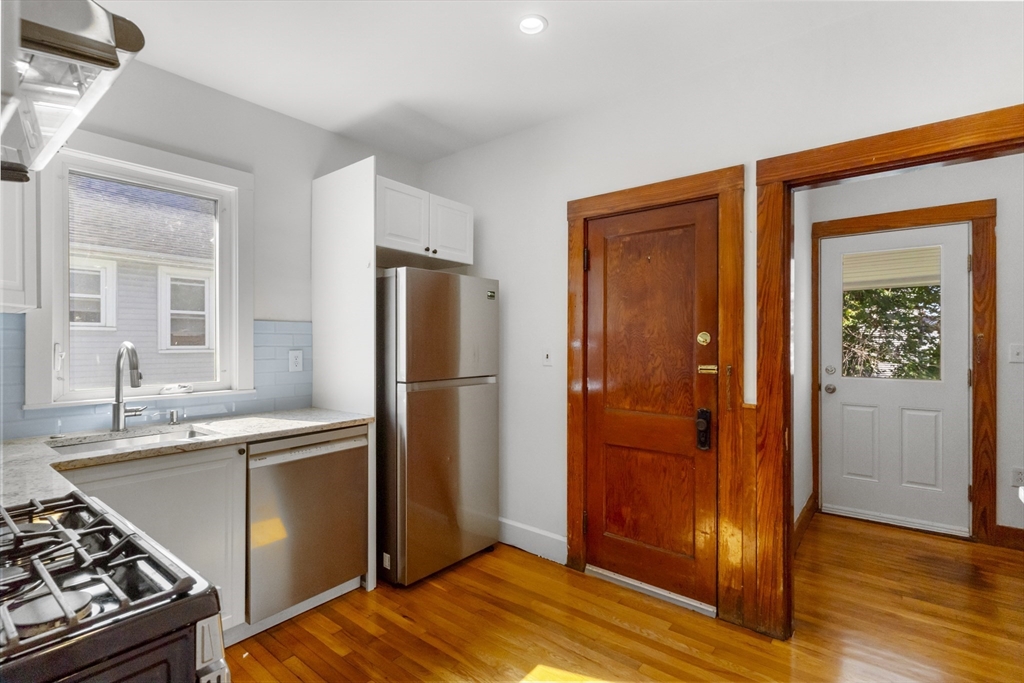 36 Turner Street, Unit 2 Boston, MA 02135 - Photo 5 of 31 a kitchen with stainless steel appliances granite countertop a refrigerator and a sink