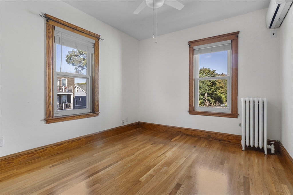 36 Turner Street, Unit 2 Boston, MA 02135 - Photo 7 of 31 a view of an empty room with wooden floor and a window