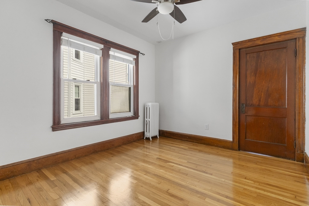 36 Turner Street, Unit 2 Boston, MA 02135 - Photo 9 of 31 a view of an empty room with wooden floor and a window