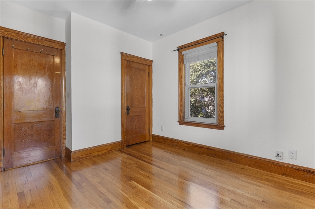 36 Turner Street, Unit 2 Boston, MA 02135 - Photo 10 of 31 a view of an empty room with wooden floor and a window
