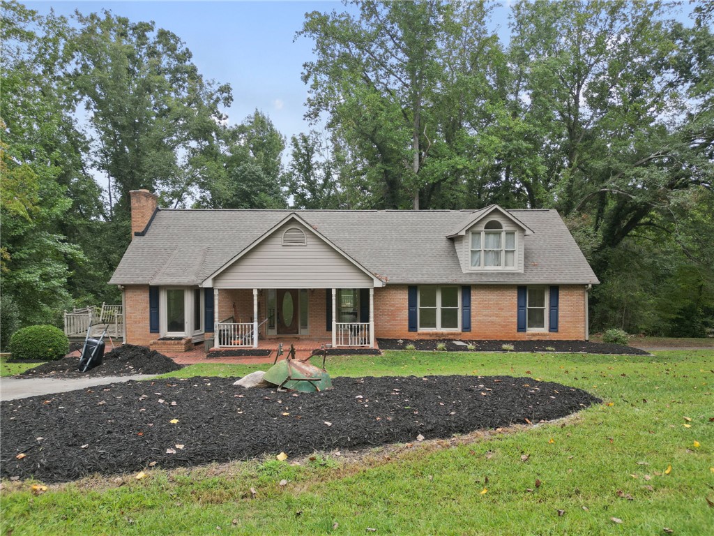 133 Pinetree Lane Easley, SC 29640 - Photo 1 of 28 Classic brick accents and a welcoming front porch define this charming single-story residence.