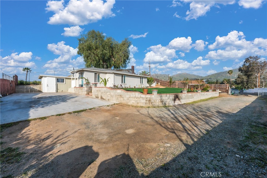 11912 Hudden Street Riverside, CA 92505 - Photo 1 of 1 a view of a house with a yard