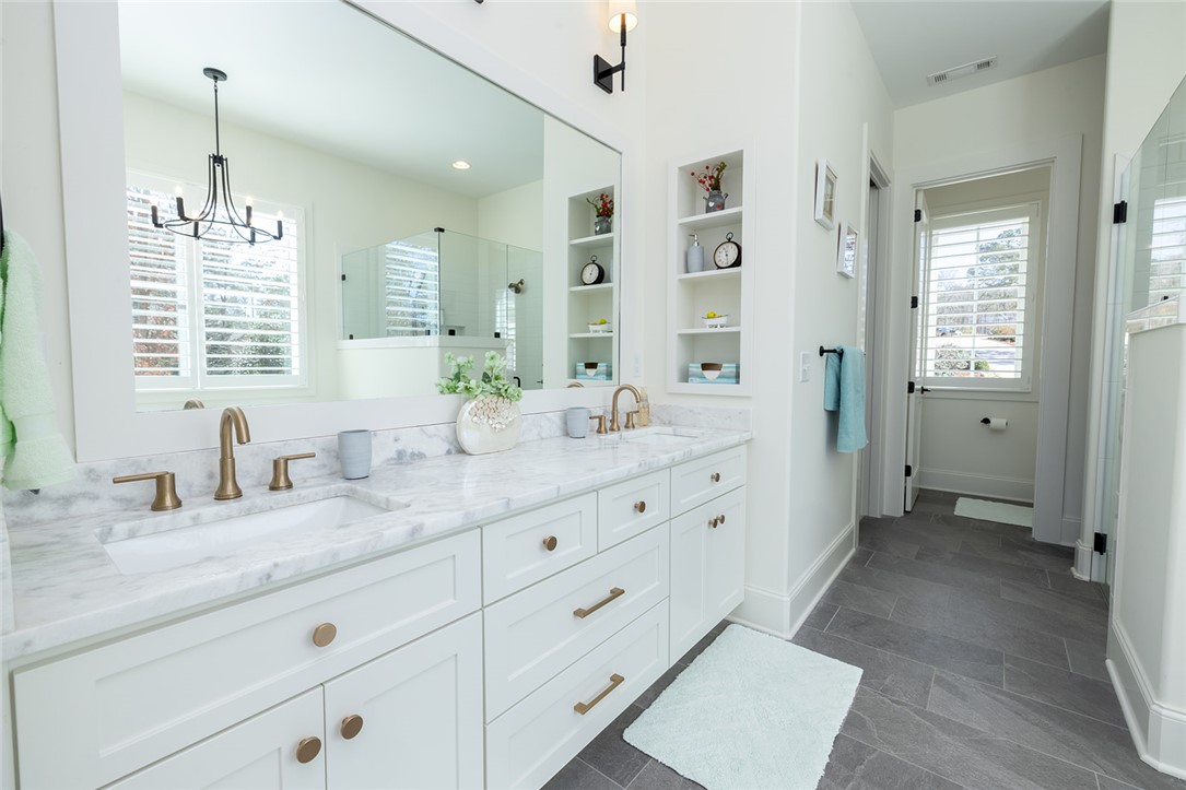 516 Pointe W Drive Seneca, SC 29672 - Photo 22 of 47 The luxurious ensuite bath is a spa-like retreat,