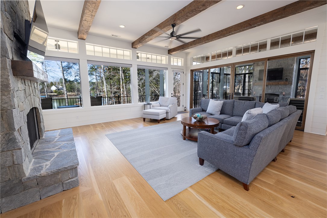 516 Pointe W Drive Seneca, SC 29672 - Photo 6 of 47 The living room is anchored by a striking floor-to