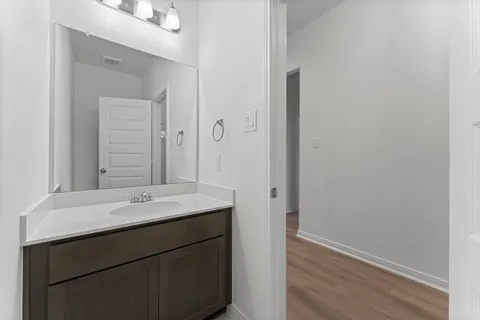 a bathroom with a sink and a mirror
