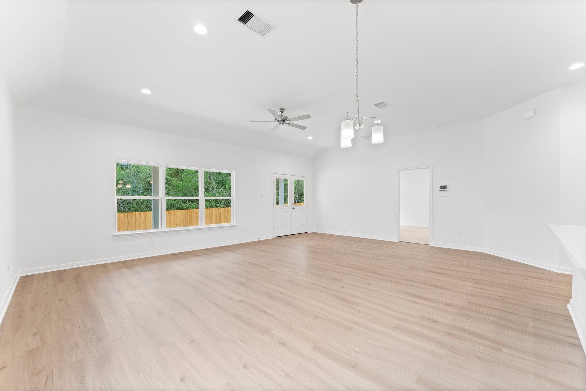 12011 Noble Heart Drive Willis, TX 77318 - Photo 19 of 35 a view of an empty room with a window and cabinets