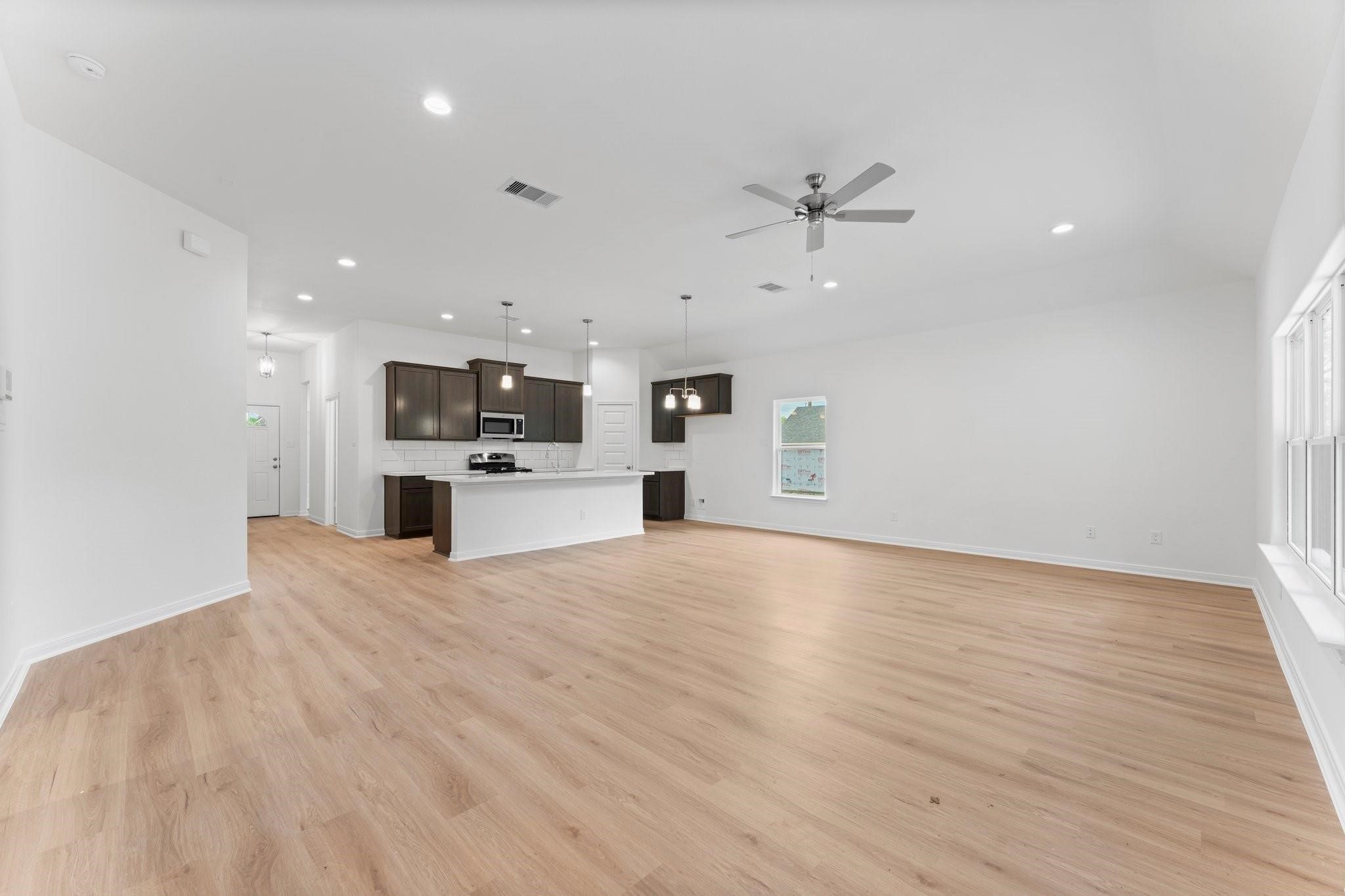 12011 Noble Heart Drive Willis, TX 77318 - Photo 21 of 35 a view of a kitchen with a dishwasher and a stove top oven