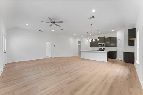 a view of a kitchen with a sink and an oven
