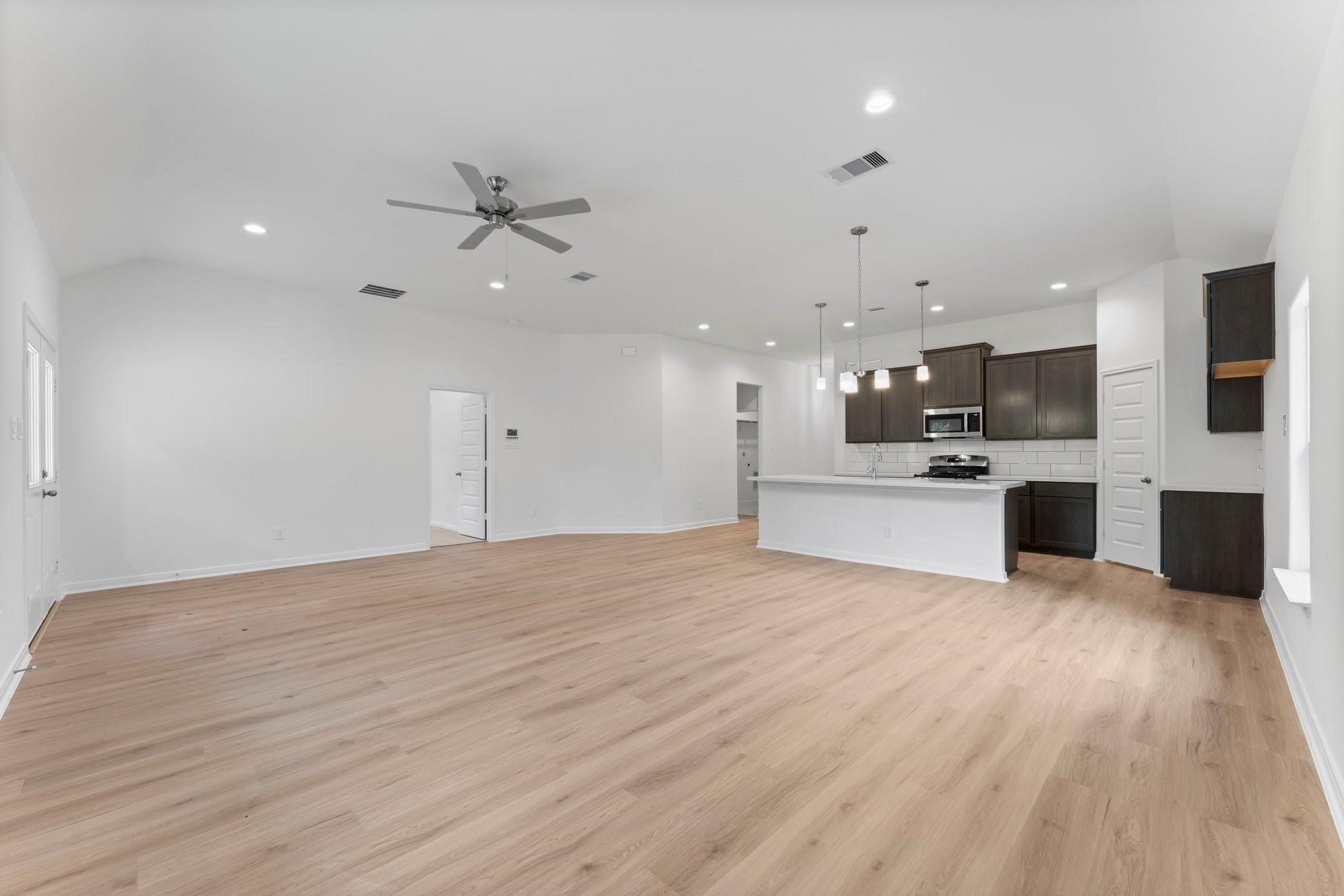 12011 Noble Heart Drive Willis, TX 77318 - Photo 22 of 35 a view of a kitchen with a sink and an oven