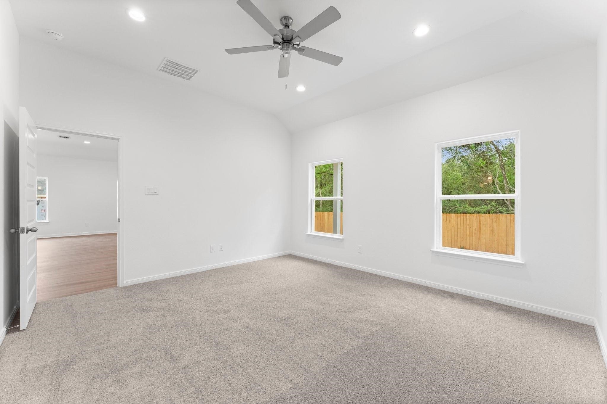 12011 Noble Heart Drive Willis, TX 77318 - Photo 24 of 35 wooden floor in an empty room with a window