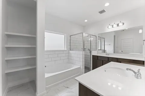 a bathroom with a bathtub and a sink