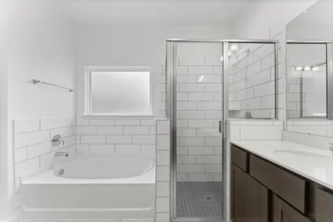 a bathroom with a bathtub and a sink