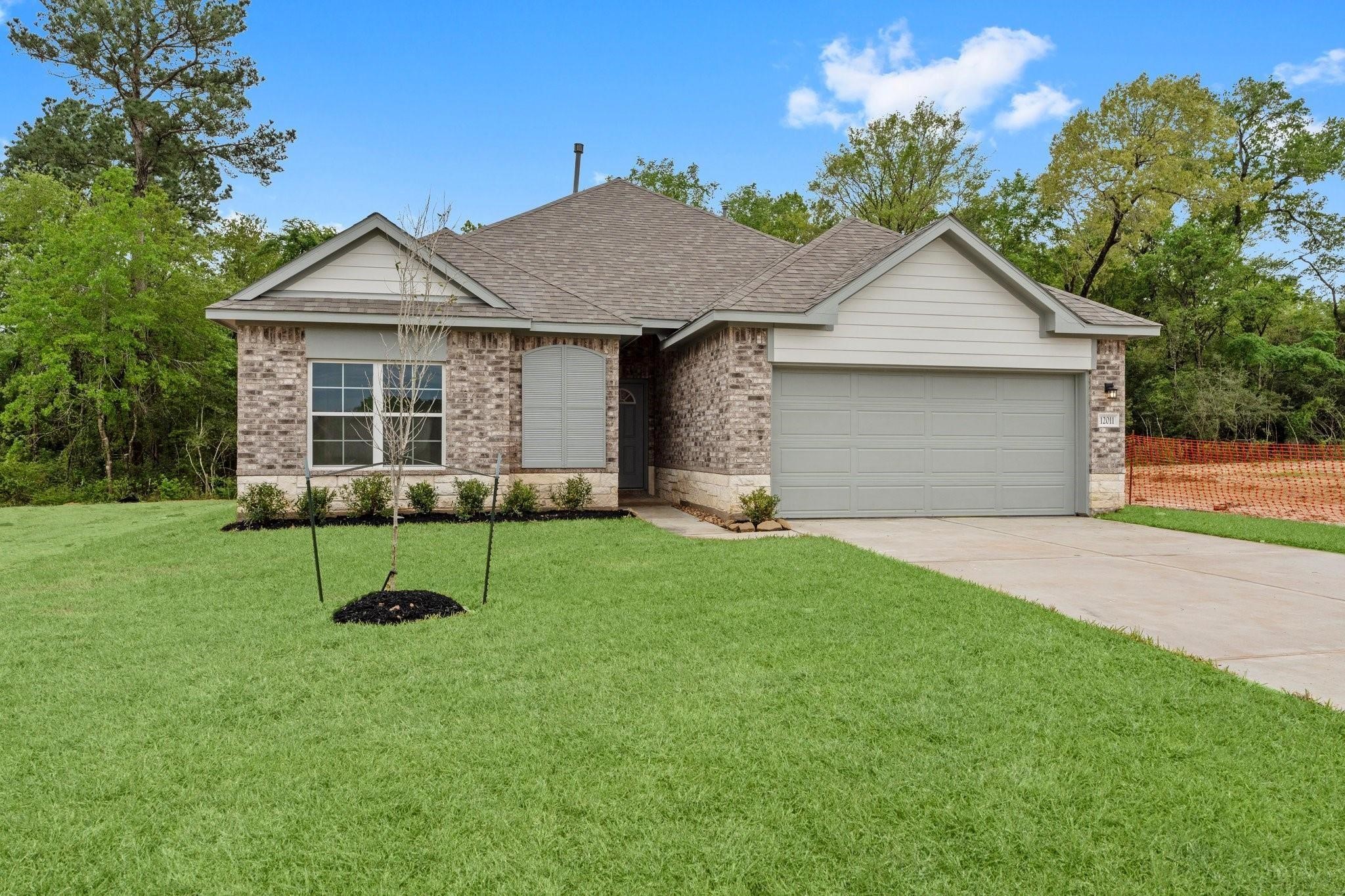 12011 Noble Heart Drive Willis, TX 77318 - Photo 3 of 35 a view of house with backyard