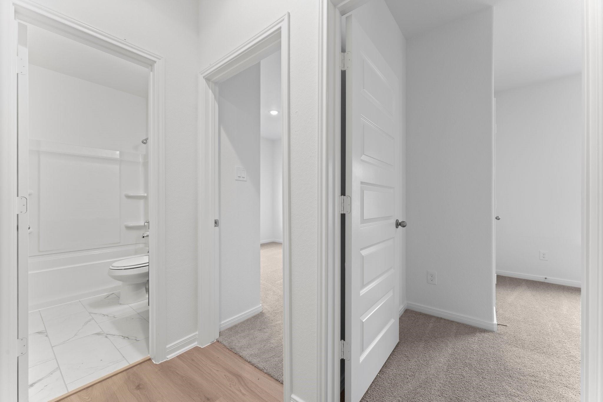 12011 Noble Heart Drive Willis, TX 77318 - Photo 6 of 35 a bathroom with white walls