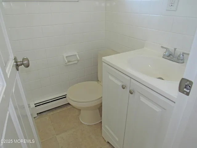 a bathroom with a toilet and a sink