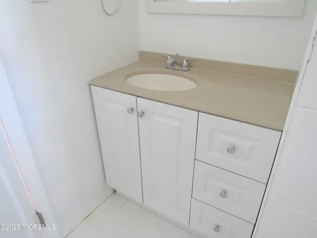 a bathroom with a sink and vanity