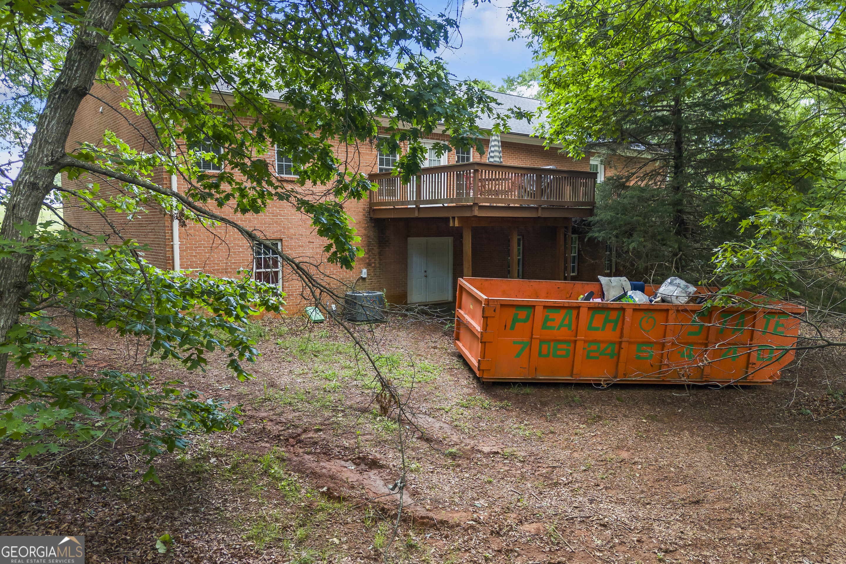 1112 Reno Road Royston, GA 30662 - Photo 21 of 74 a view of a wooden deck with large trees