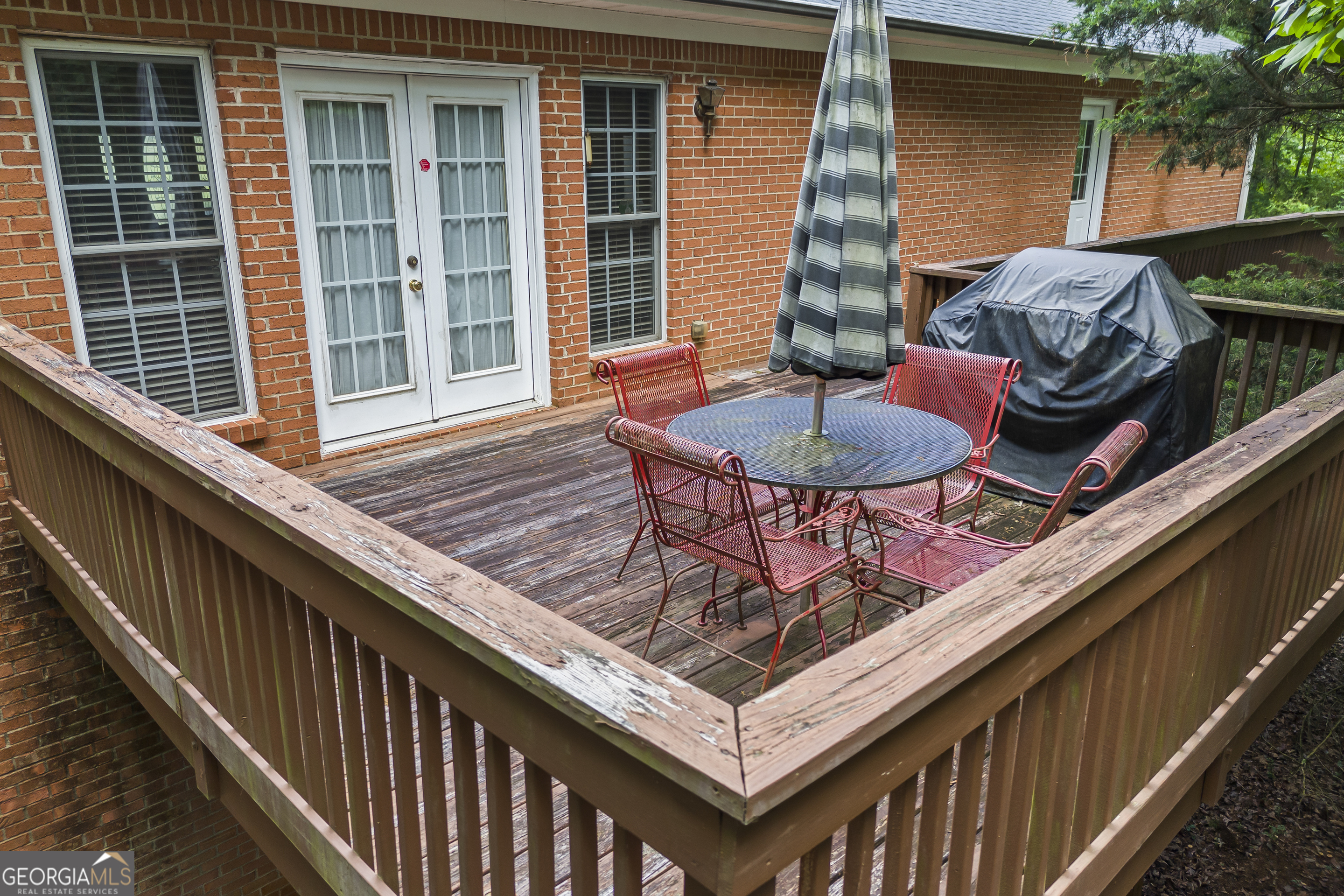 1112 Reno Road Royston, GA 30662 - Photo 23 of 74 a balcony with table and chairs