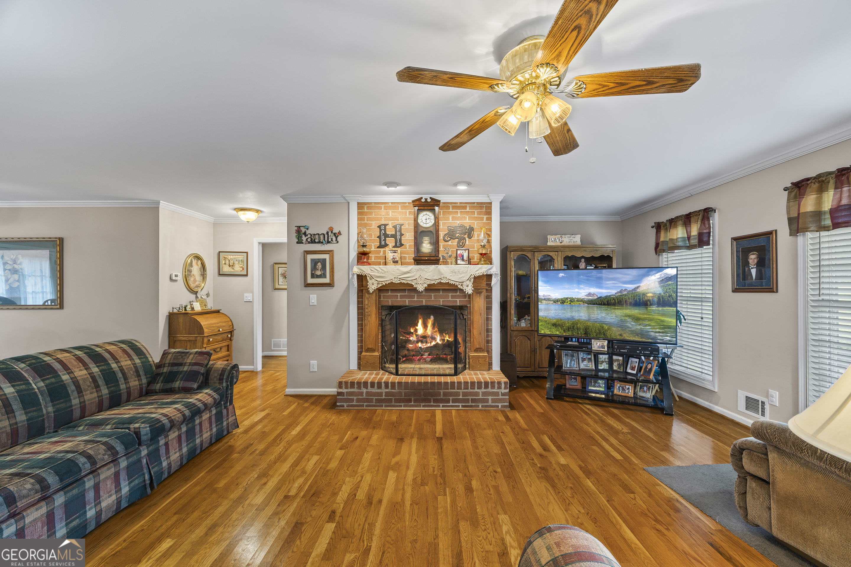 1112 Reno Road Royston, GA 30662 - Photo 31 of 74 a living room with furniture and a fireplace