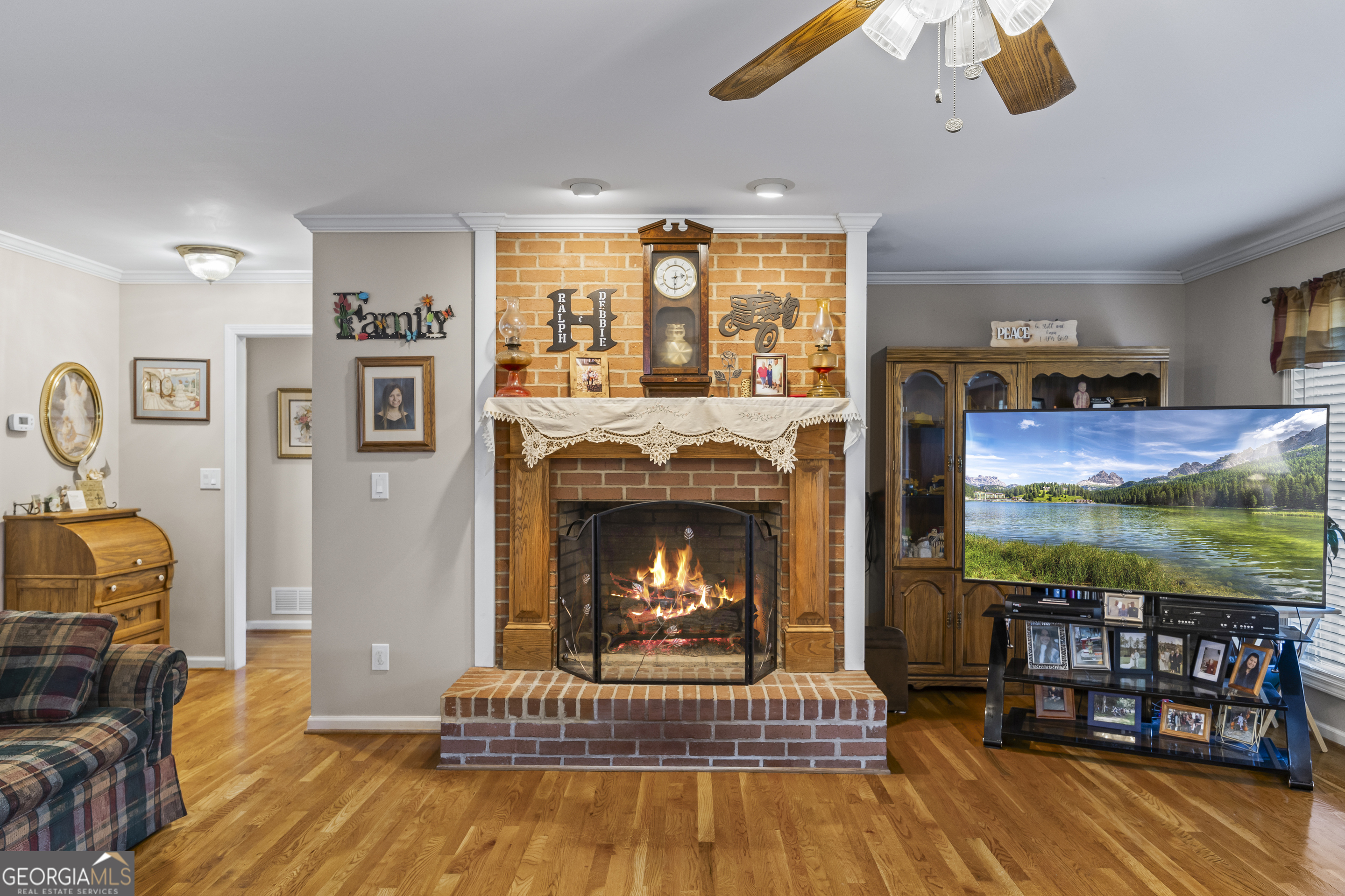 1112 Reno Road Royston, GA 30662 - Photo 32 of 74 a living room with furniture and a fireplace