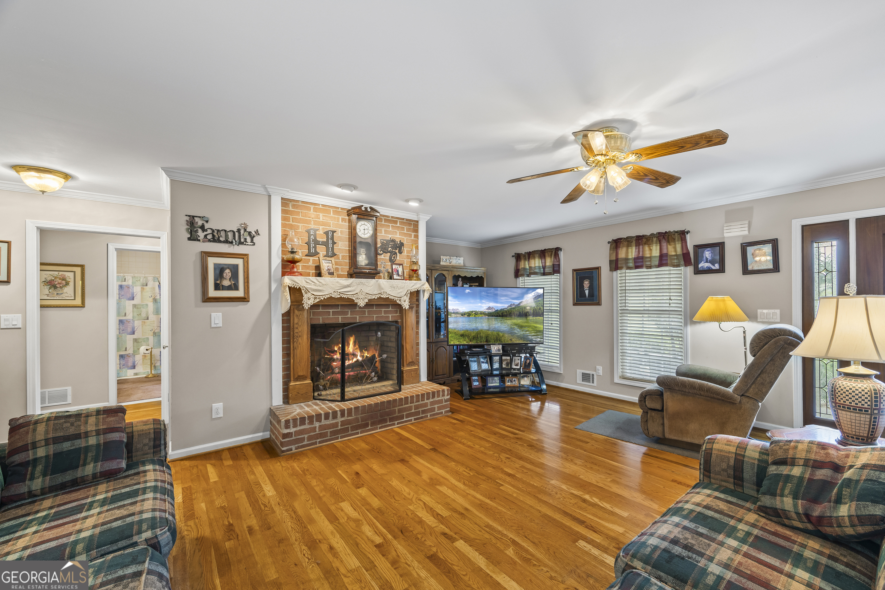 1112 Reno Road Royston, GA 30662 - Photo 33 of 74 a living room with furniture and fireplace