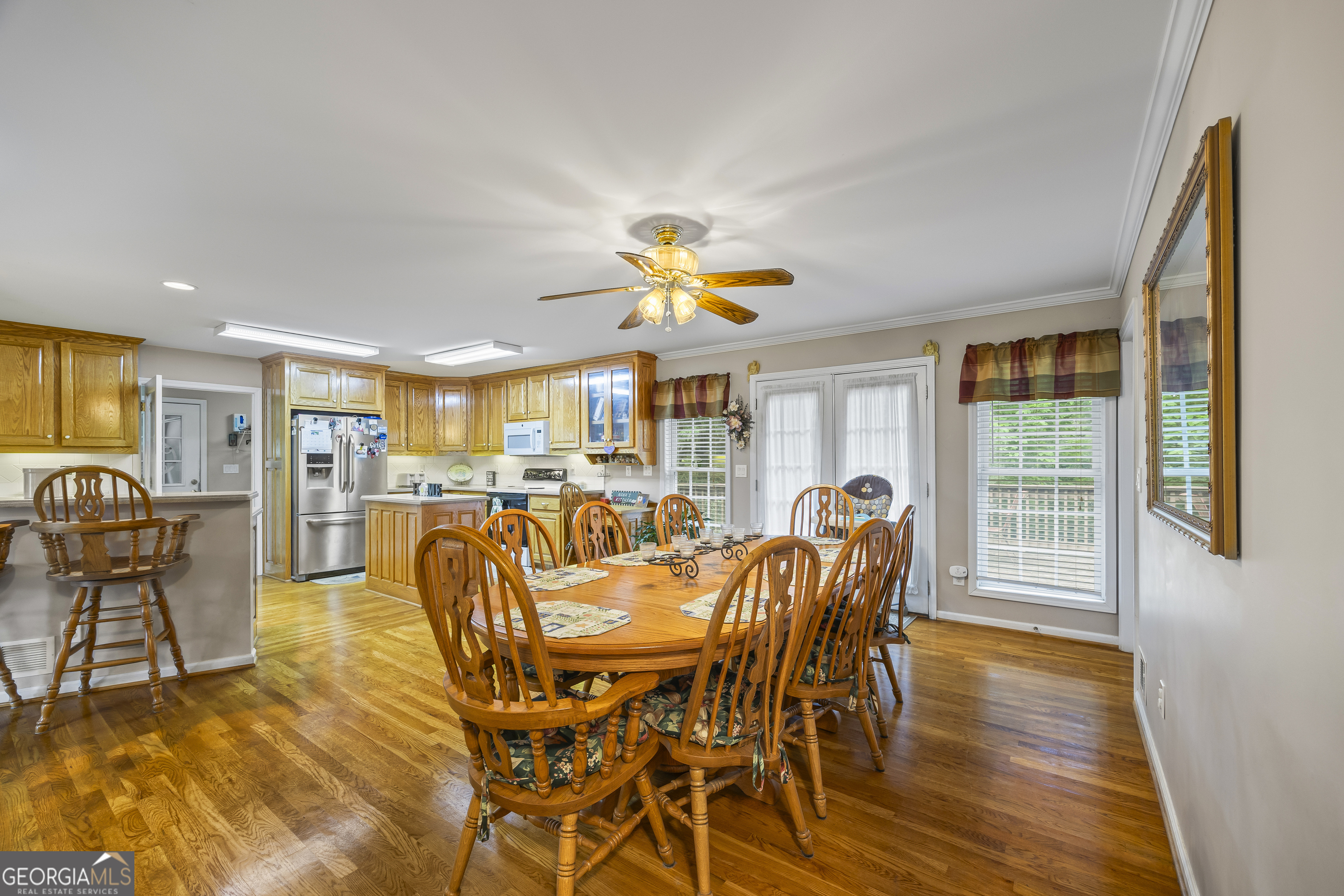1112 Reno Road Royston, GA 30662 - Photo 36 of 74 a dining room with furniture a chandelier and wooden floor