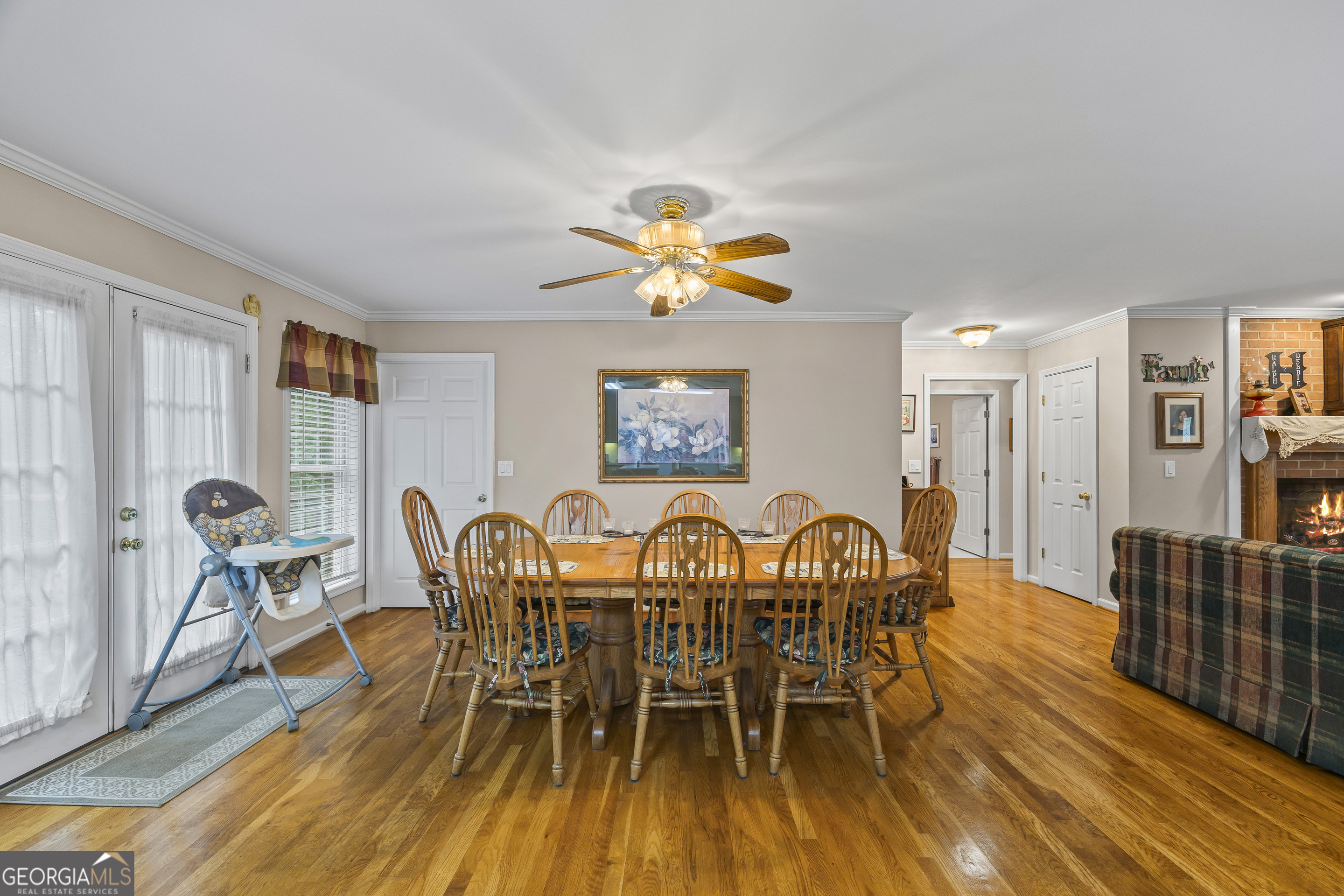 1112 Reno Road Royston, GA 30662 - Photo 37 of 74 a view of a dining room with furniture a chandelier and wooden floor