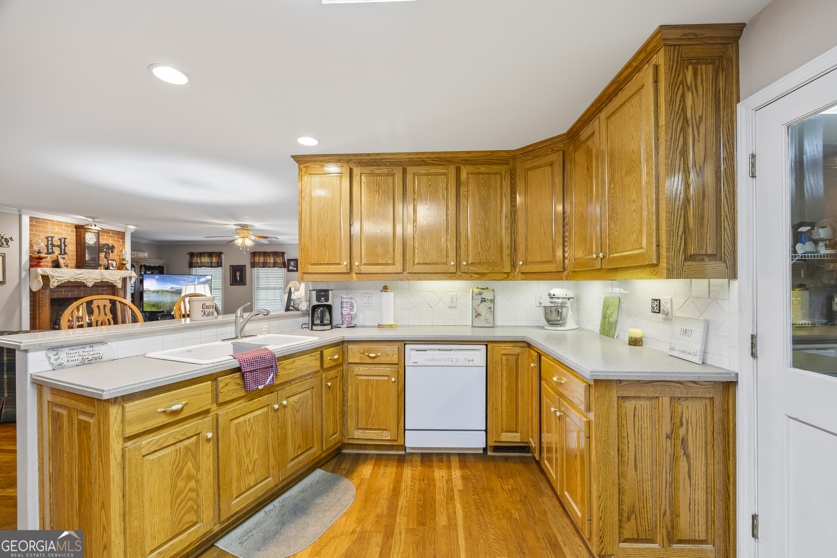 1112 Reno Road Royston, GA 30662 - Photo 43 of 74 a kitchen with stainless steel appliances granite countertop wooden cabinets a sink and dishwasher