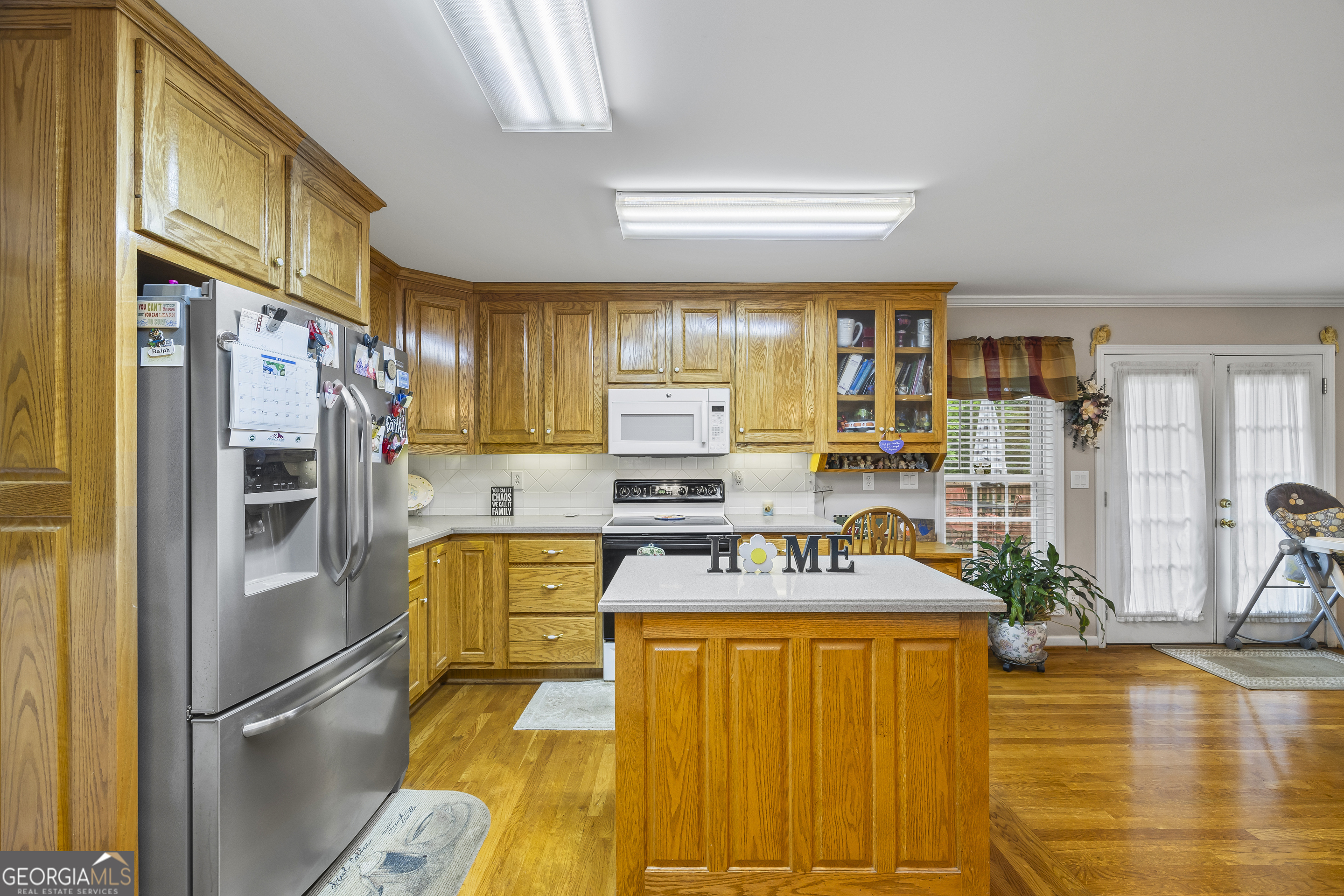 1112 Reno Road Royston, GA 30662 - Photo 46 of 74 a kitchen with stainless steel appliances granite countertop a refrigerator and a stove