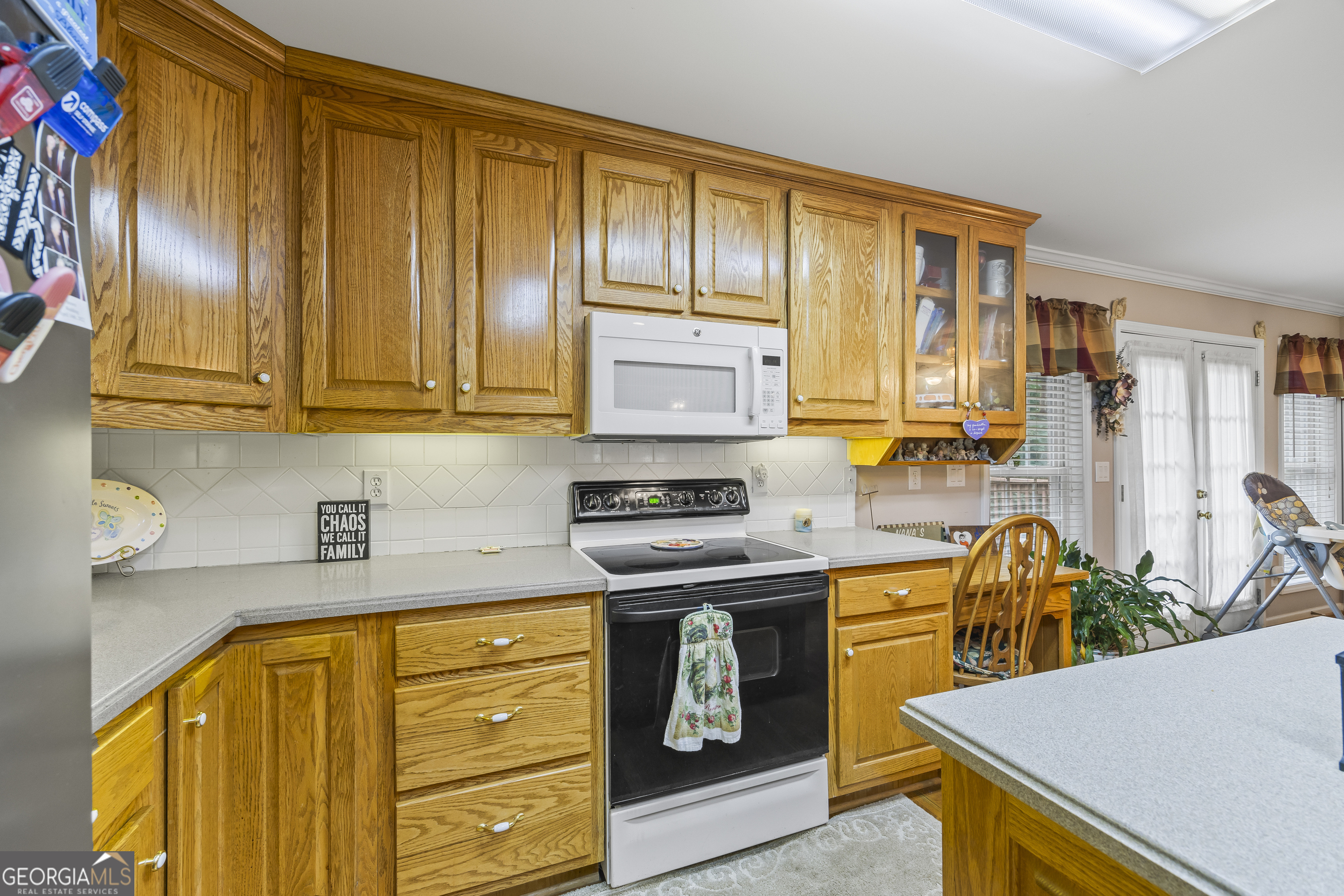 1112 Reno Road Royston, GA 30662 - Photo 47 of 74 a kitchen with stainless steel appliances granite countertop wooden cabinets a stove top oven a sink and dishwasher