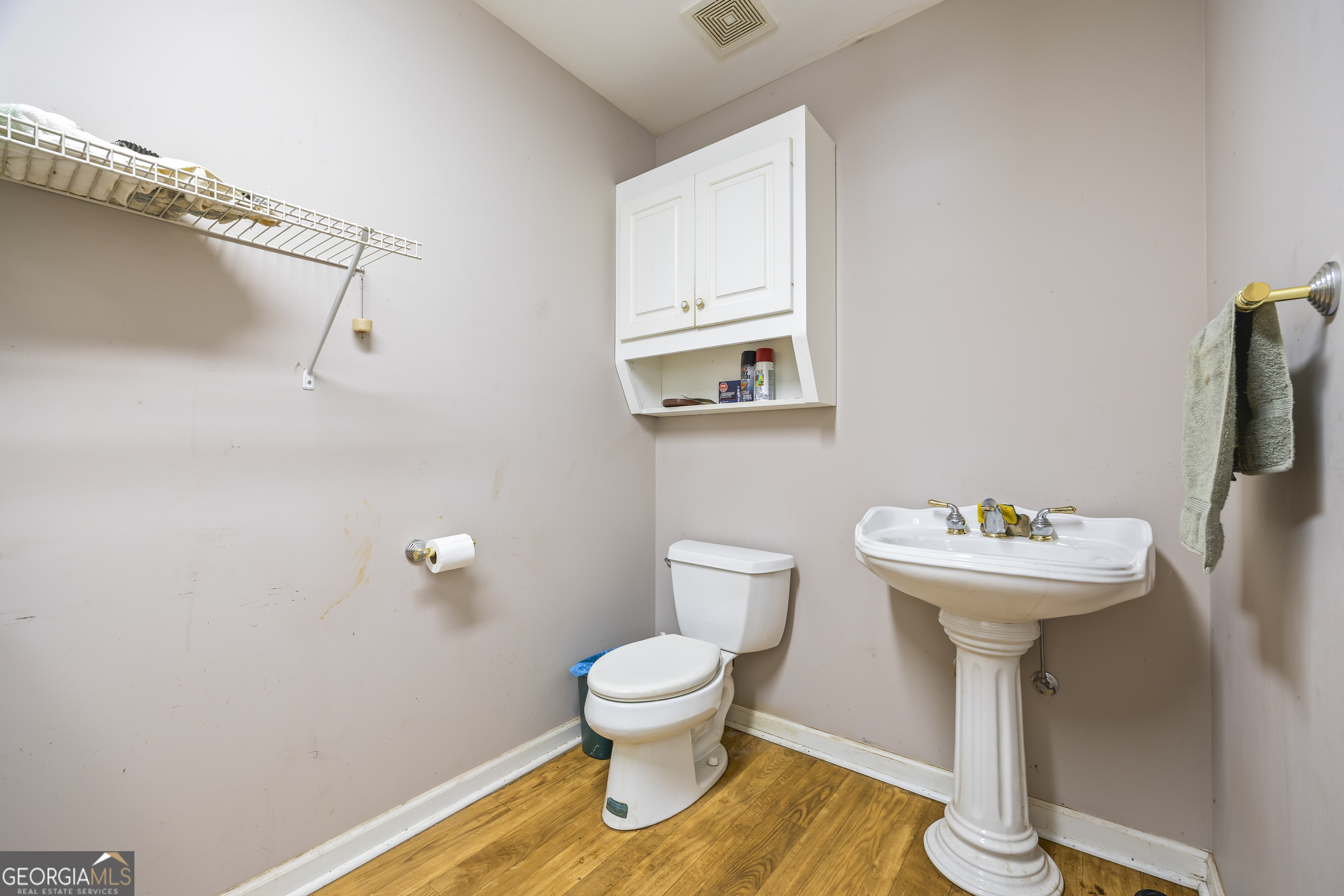 1112 Reno Road Royston, GA 30662 - Photo 50 of 74 a bathroom with a sink toilet and a mirror