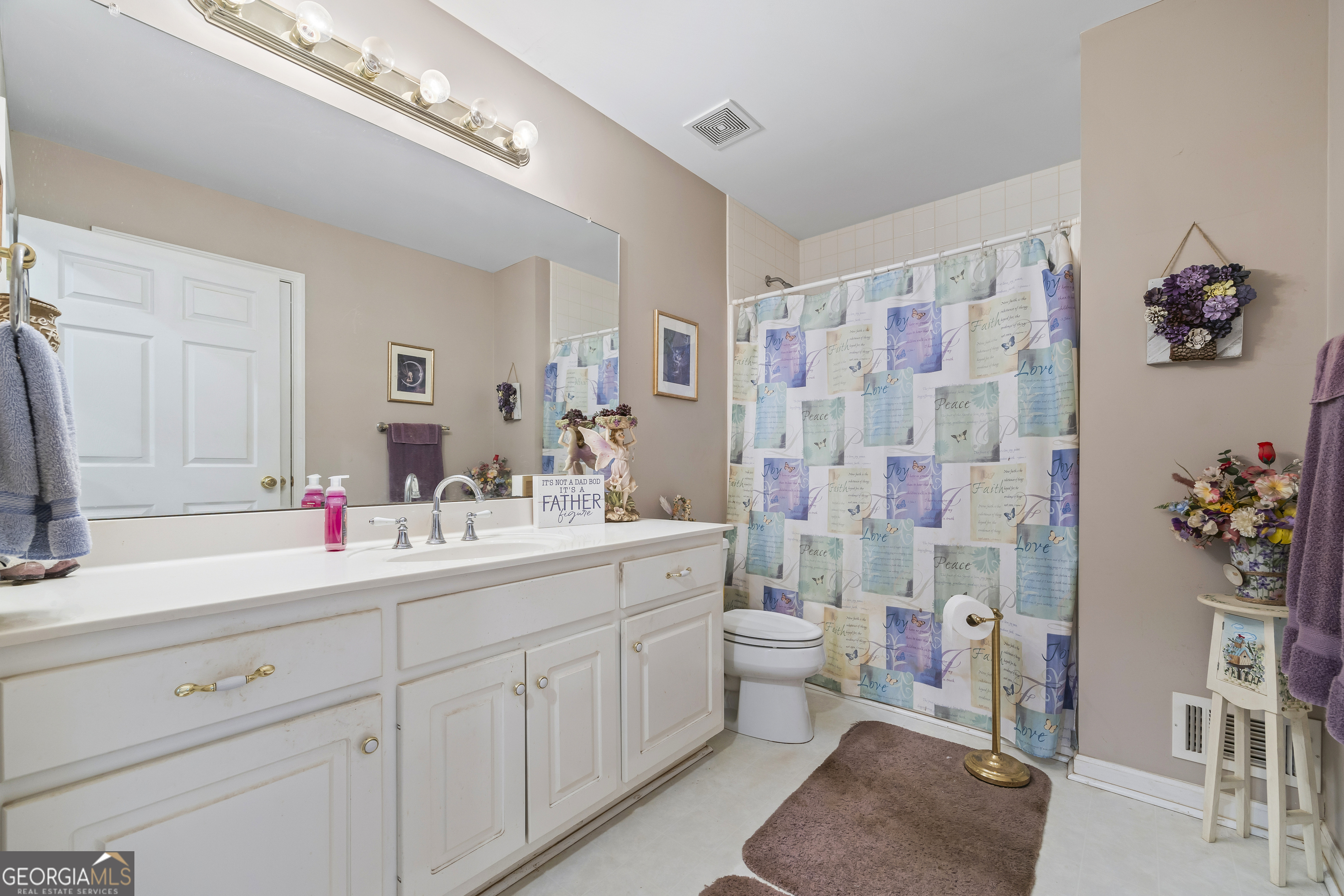 1112 Reno Road Royston, GA 30662 - Photo 51 of 74 a bathroom with a sink mirror and a shower