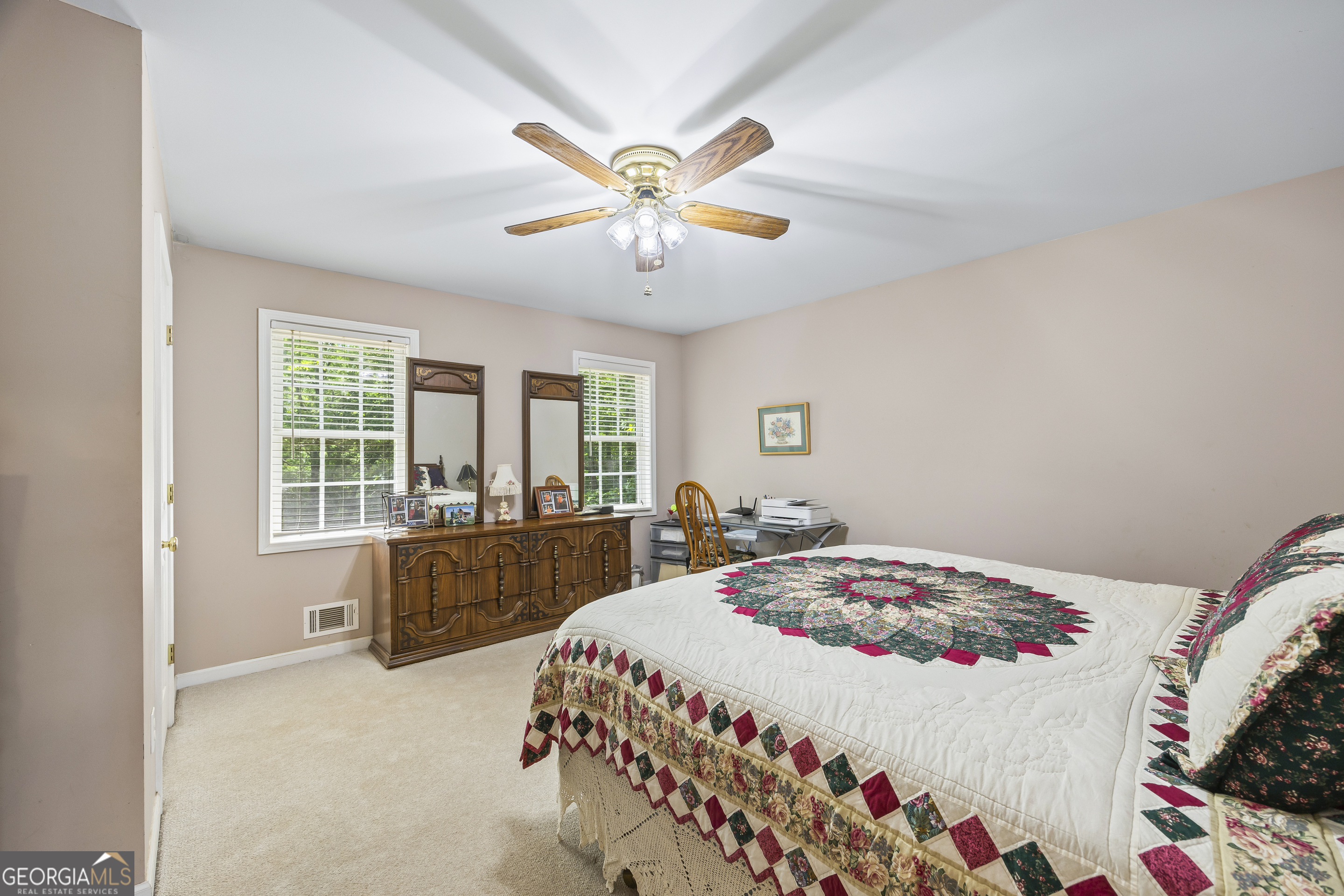 1112 Reno Road Royston, GA 30662 - Photo 52 of 74 a bedroom with a bed and a chandelier