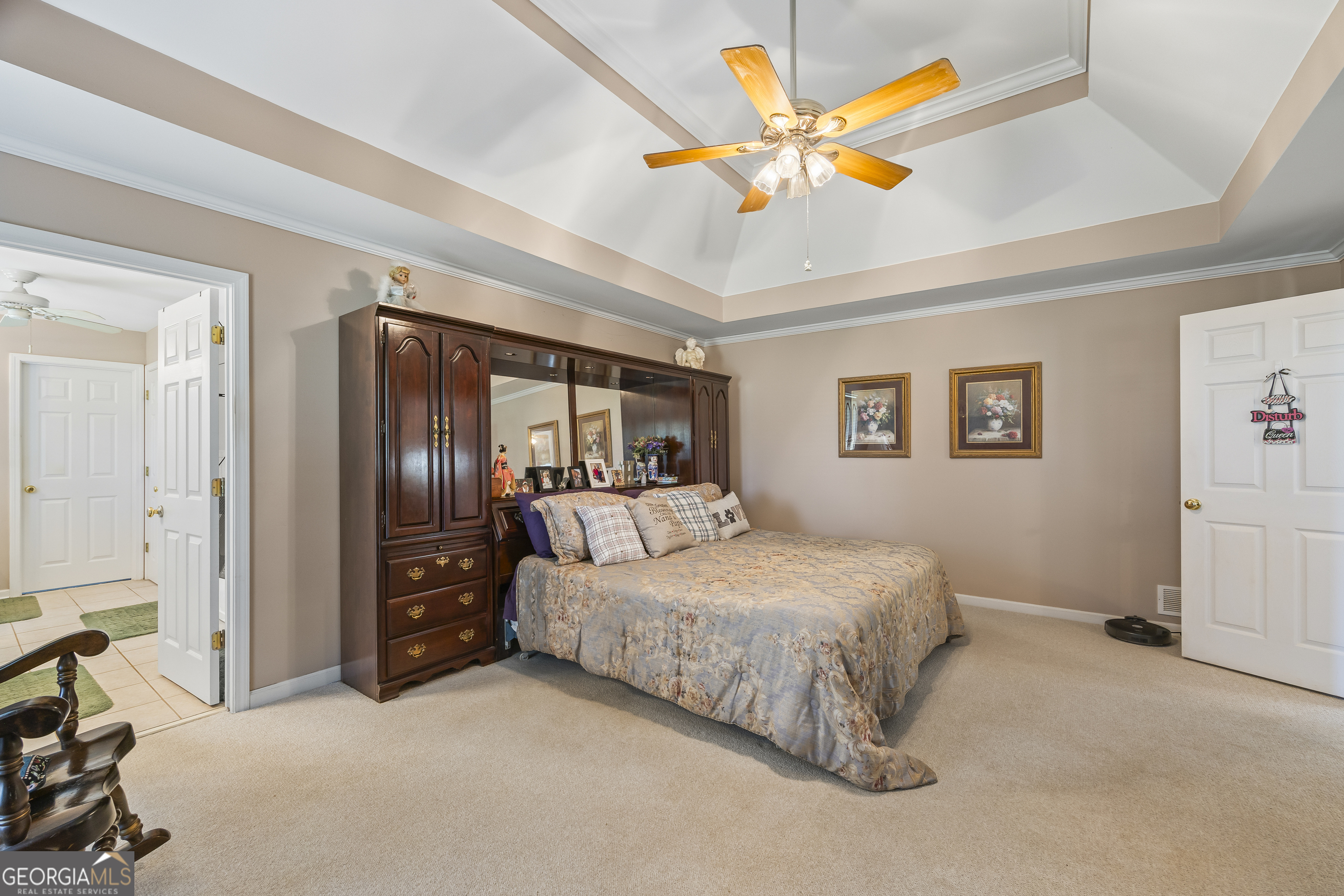 1112 Reno Road Royston, GA 30662 - Photo 58 of 74 a bedroom with a bed and a chandelier
