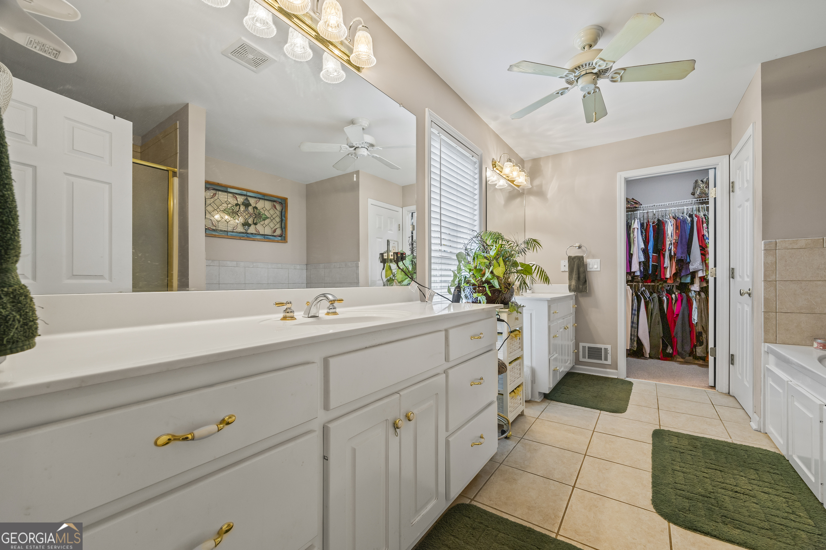 1112 Reno Road Royston, GA 30662 - Photo 62 of 74 a spacious bathroom with a double vanity sink mirror and