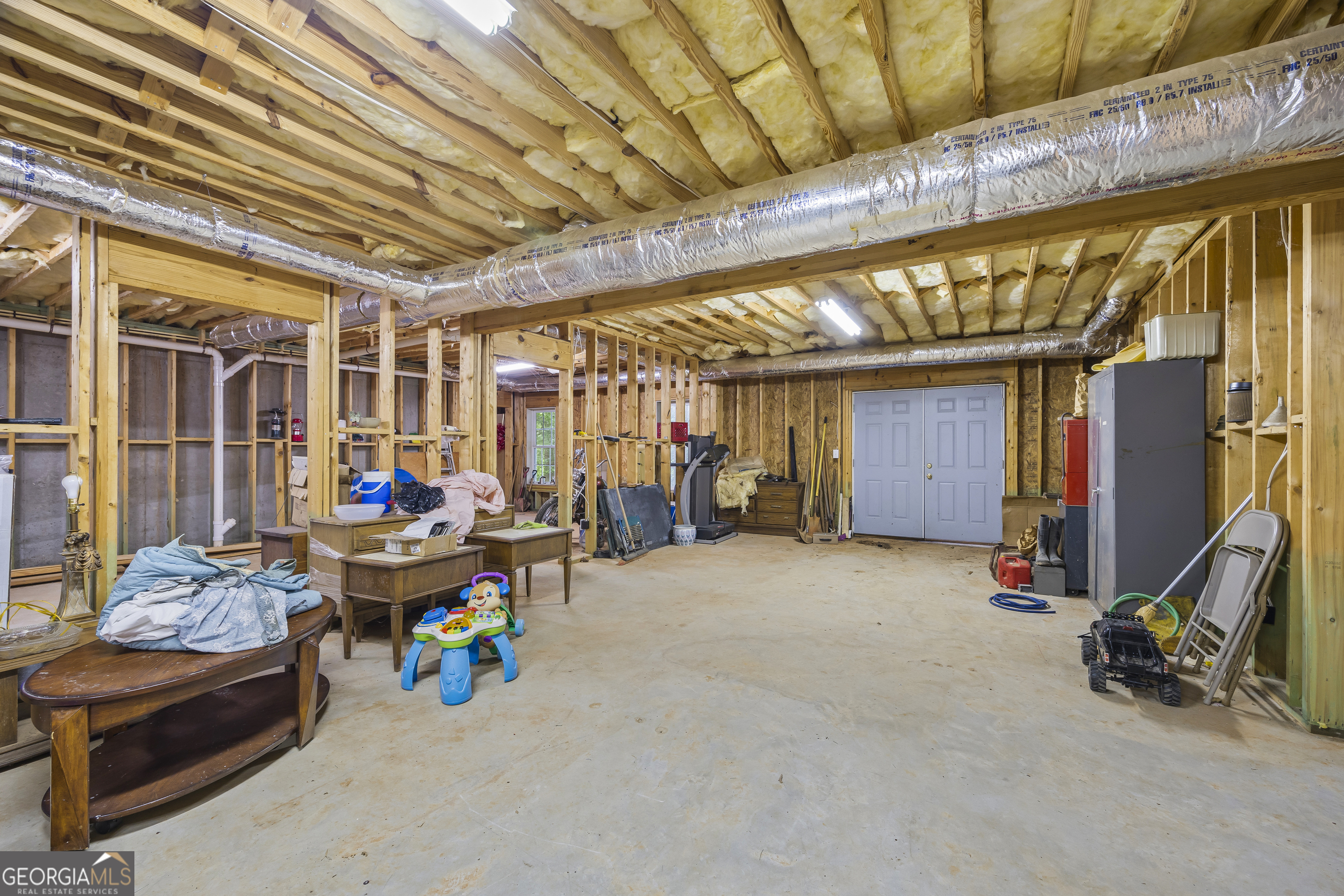 1112 Reno Road Royston, GA 30662 - Photo 65 of 74 a view of a storage room with furniture and a window