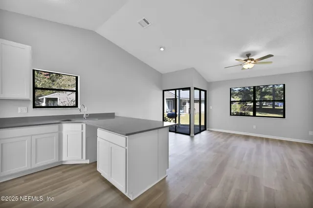 a kitchen with a stove and cabinets