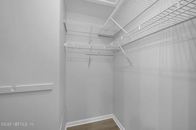 a view of a room with racks on the wall