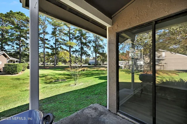 a view of a porch with a yard
