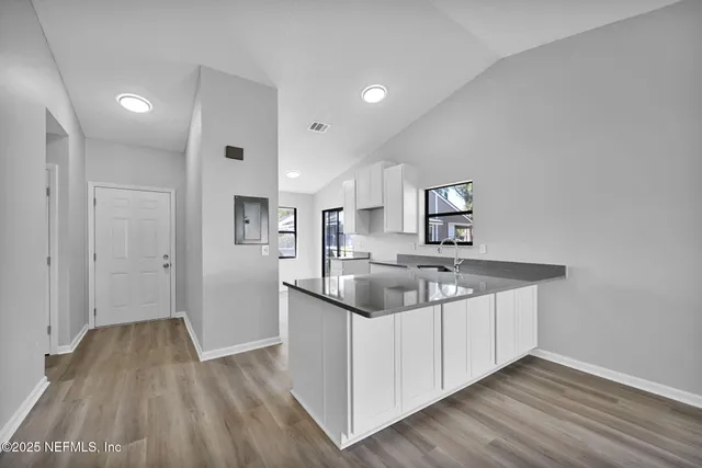 a kitchen with a sink and cabinets