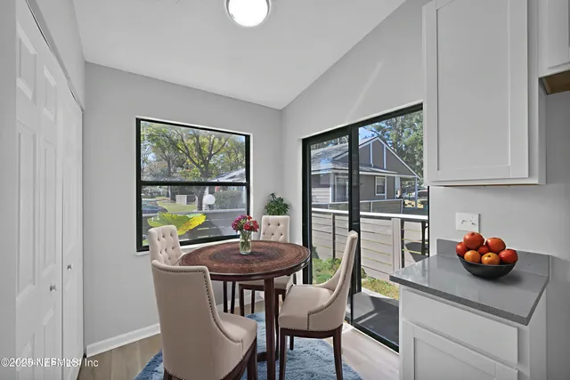 a kitchen with a table and chairs in it