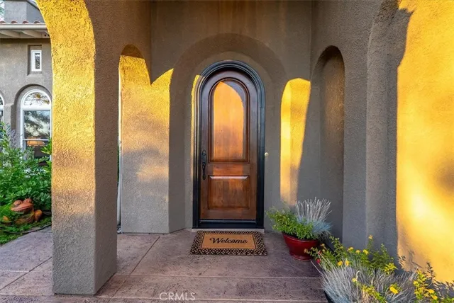a living room with furniture a fireplace and a large window
