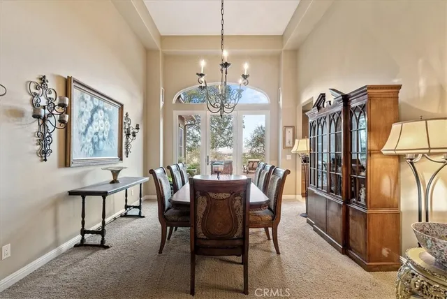 a bed sitting in a spacious bedroom next to a window