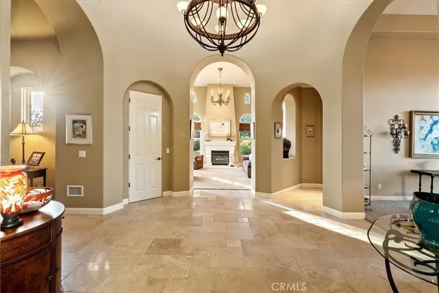 a view of a backyard with plants and patio