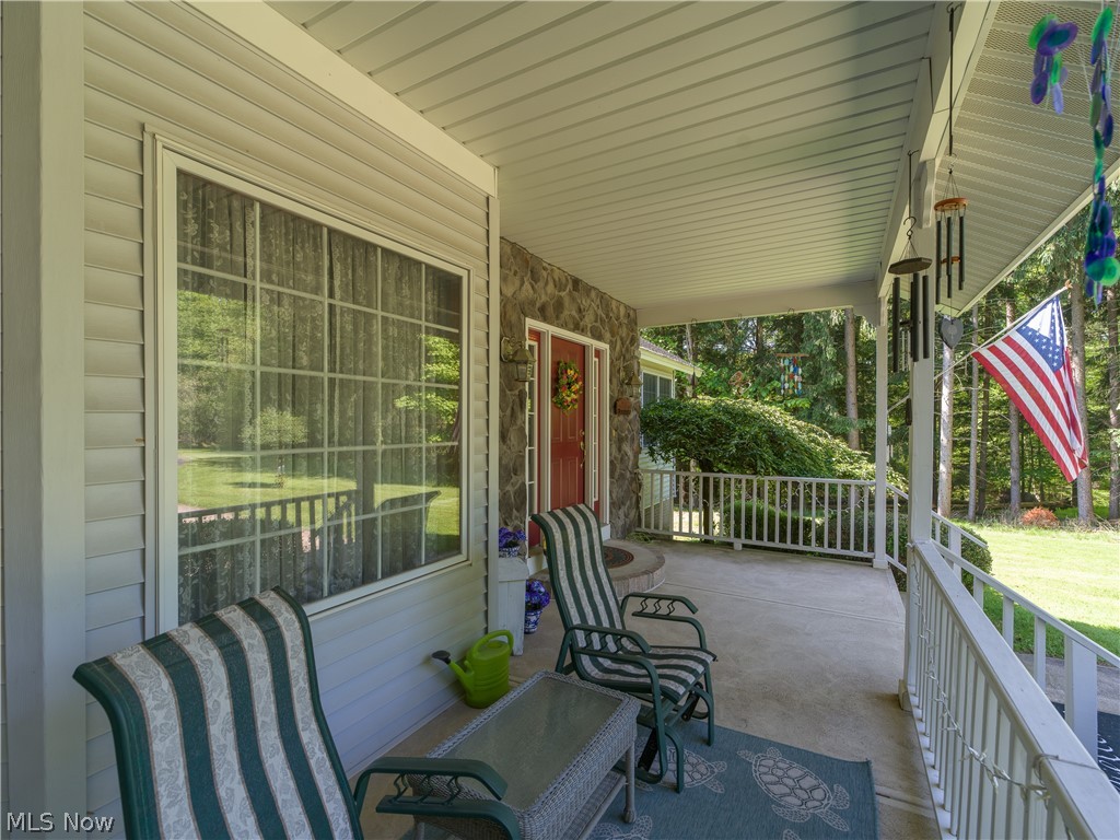 8745 Broadview Road Broadview Heights, OH 44147 - Photo 45 of 49 Expansive covered front porch with a concrete surface and white railing