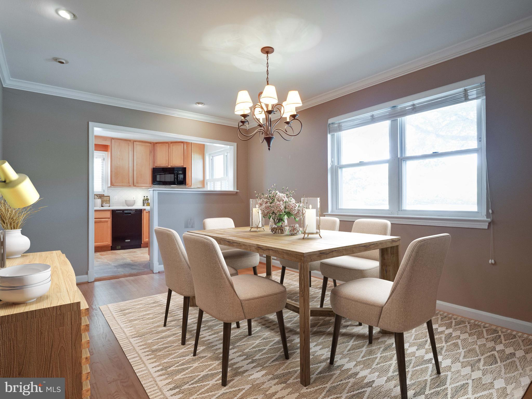 4031 North Glebe Road Arlington, VA 22207 - Photo 5 of 27 a view of a dining room with furniture a chandelier and wooden floor