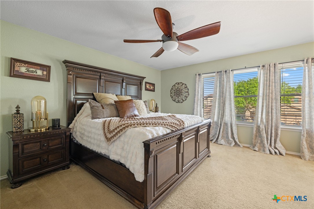 9142 Sage Loop Court Temple, TX 76502 - Photo 16 of 27 a bedroom with a bed next to a window