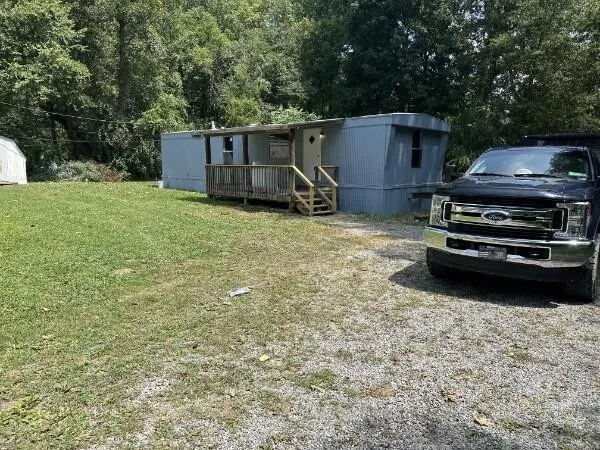 a view of a house with a back yard