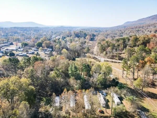 an aerial view of residential house and green space