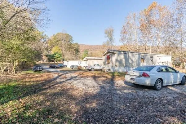 a view of street with parked cars